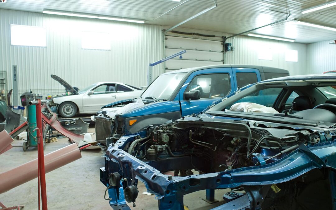 Vehicles inside automotive body shop