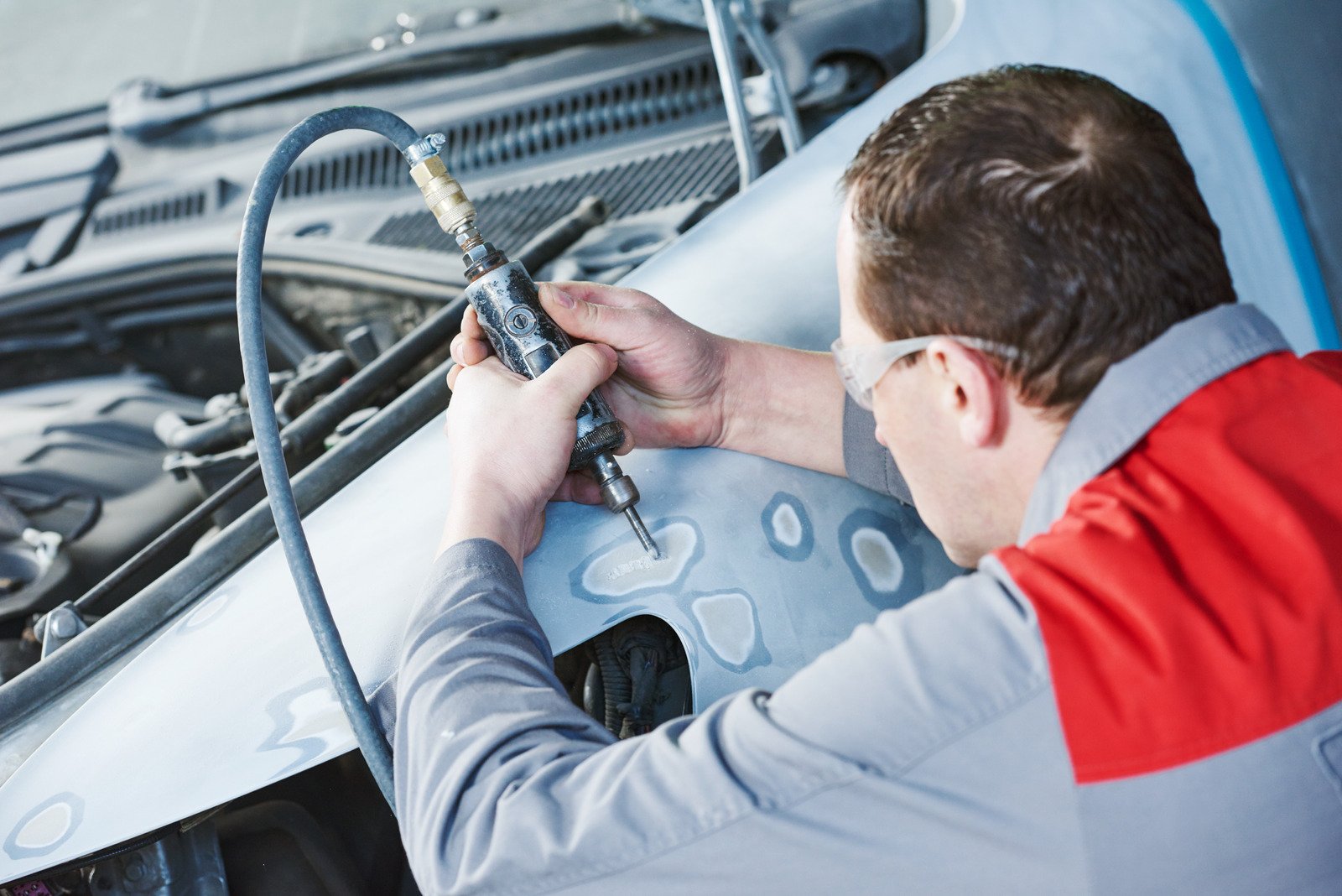 Auto Mechanic Repairing Car Autobody